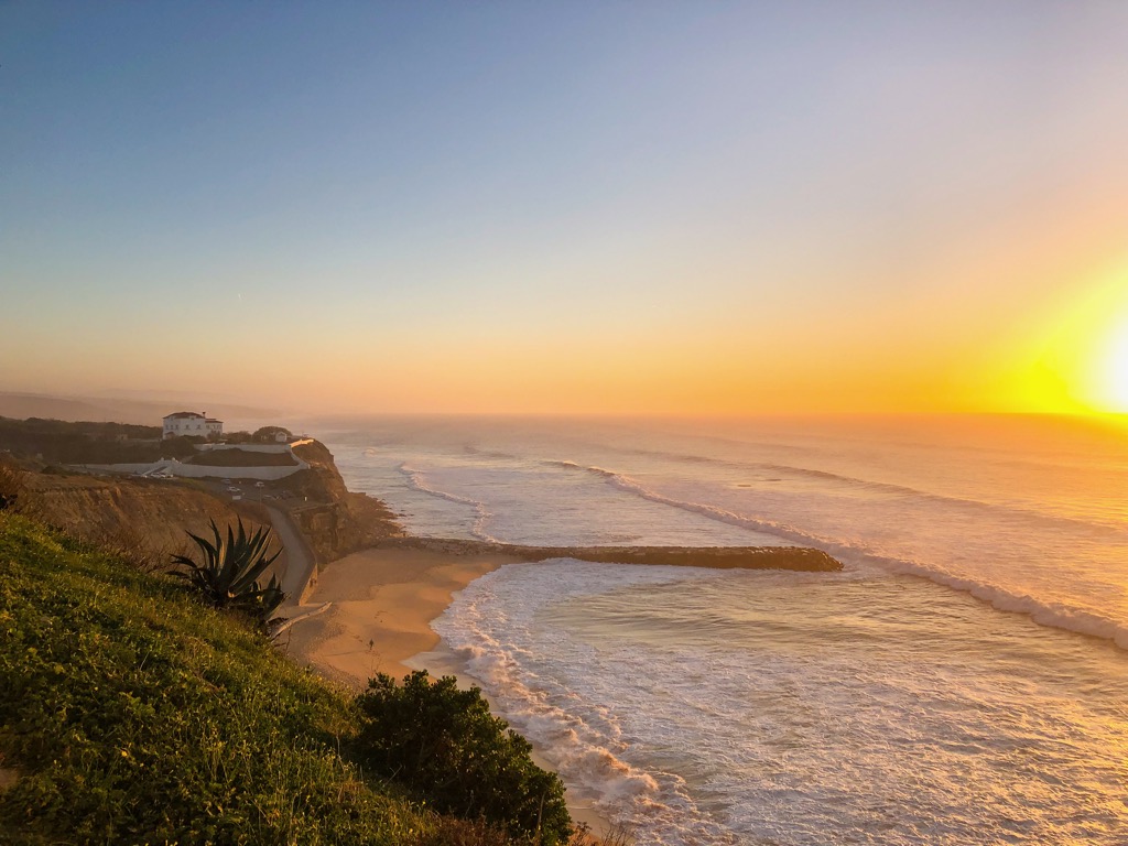 An orange and blue sunset over Praia do Sul.
