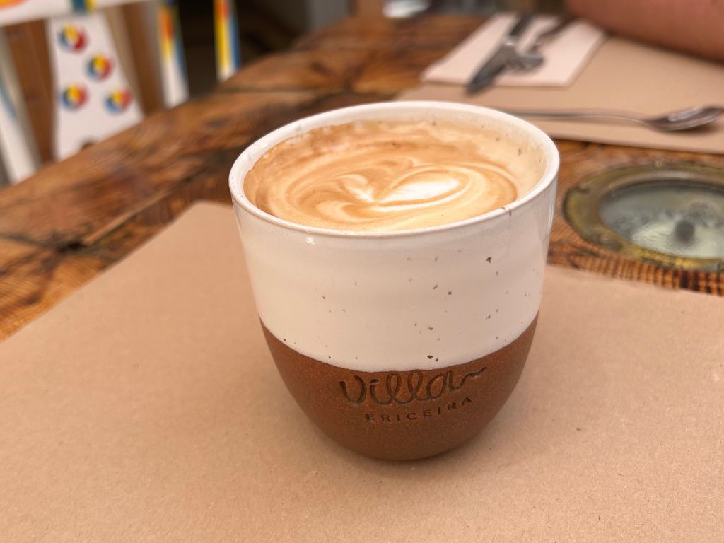 A earthware cup of coffee at Villa Brunch Cafe in Ericeira